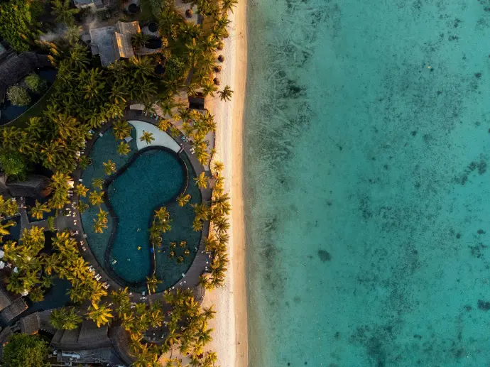 an aerial view of a beach and a resort
